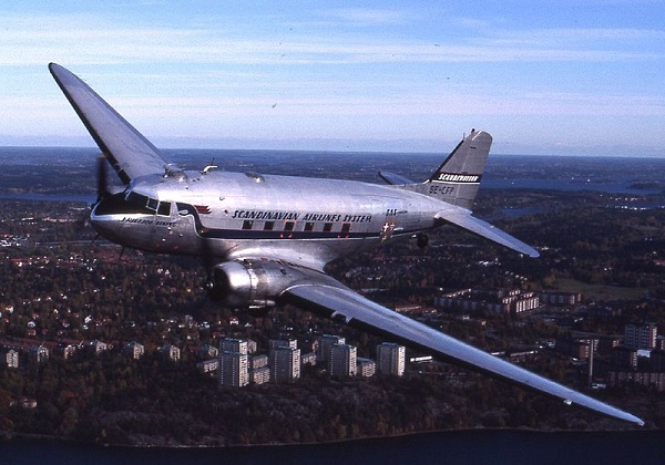  Douglas DC-3 banking to make a left turn. 